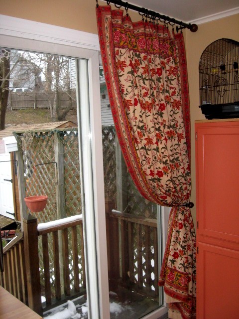 floral curtains used as a patio door panel