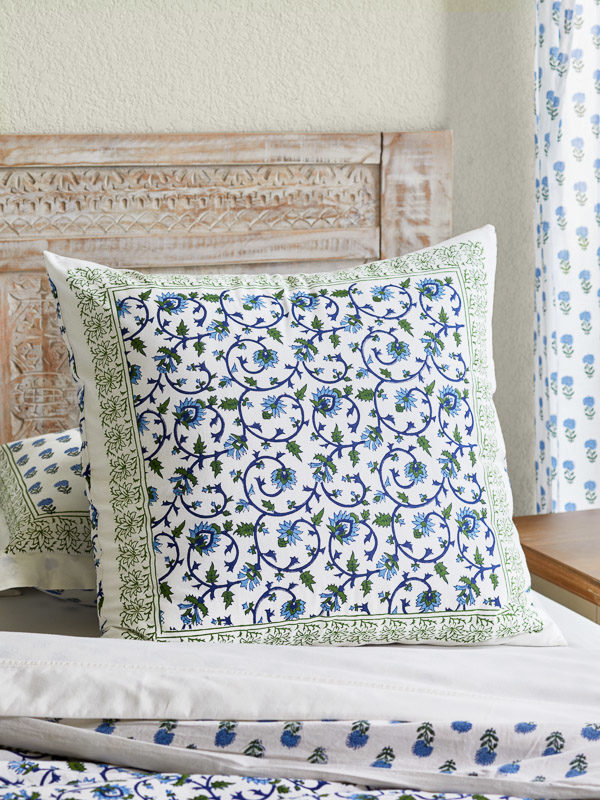 throw pillow cover in white, green, and blue floral pattern with vines
