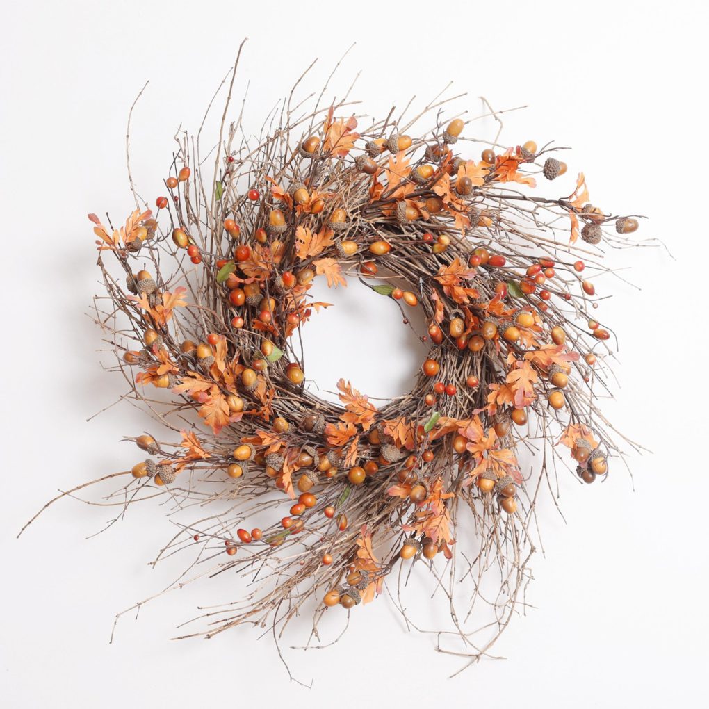 Acorn and fall leaves on twig leaves wreath for a boho bedroom.