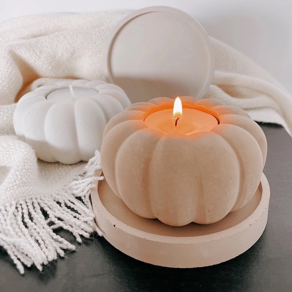 Photograph of white and cream candle holders to complement blue fall decor