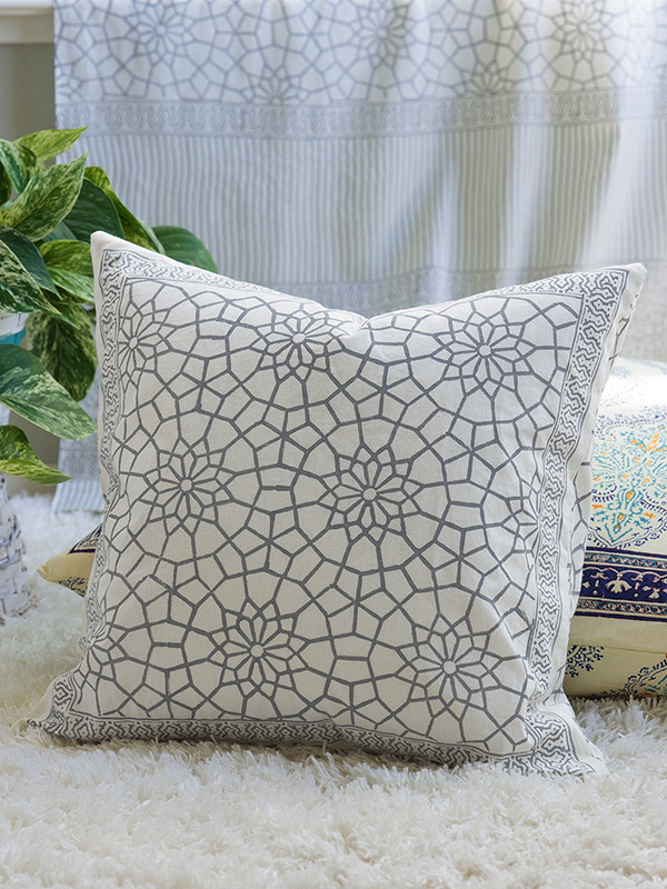 white and grey throw pillow block printed for a winter wonderland theme