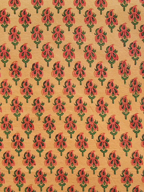 Petite paisley print with emerald green highlights, patterned across a mango hued ground.