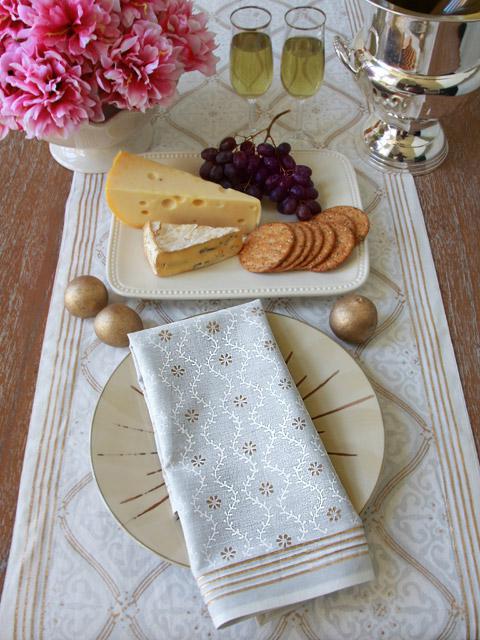 an elegant winter table in a white and gold winter wonderland theme