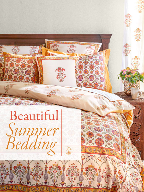 orange floral bedding with sign that says beautiful summer bedding