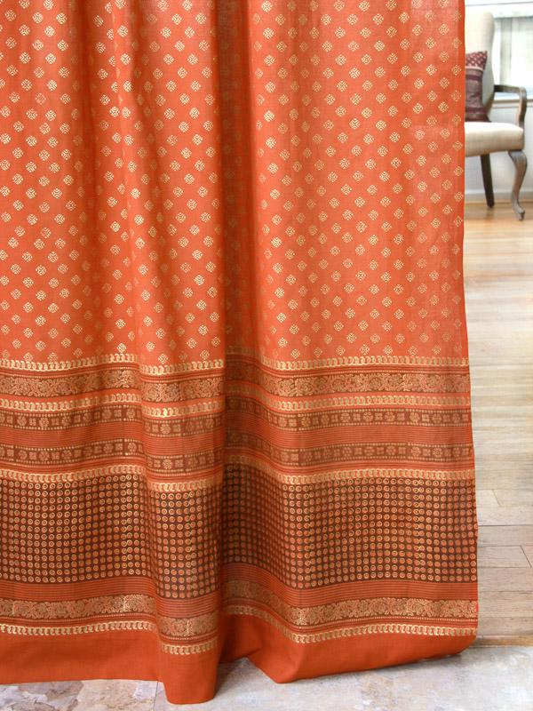 orange curtains for an orange bedroom and orange bedding