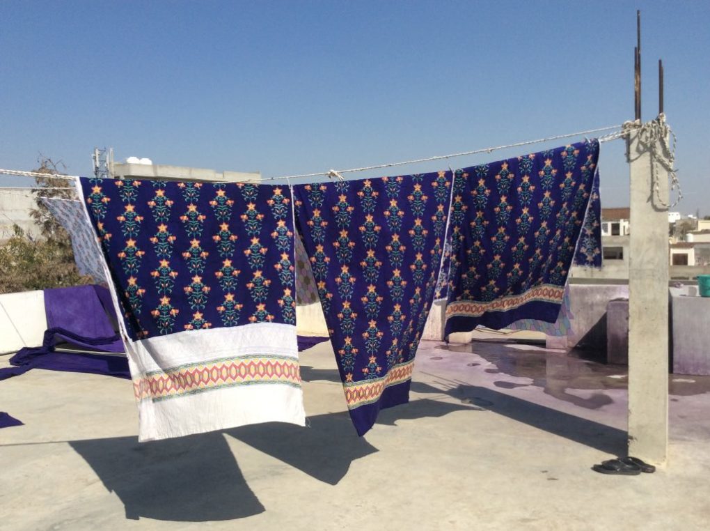 Block printed fabrics dry in the sun after a successful day of block printing.