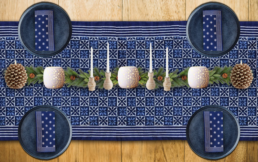 A blue Christmas table runner and winter solstice decorations for your winter solstice celebration