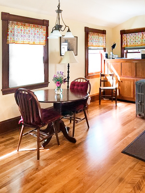 orange sheer valances in dining room