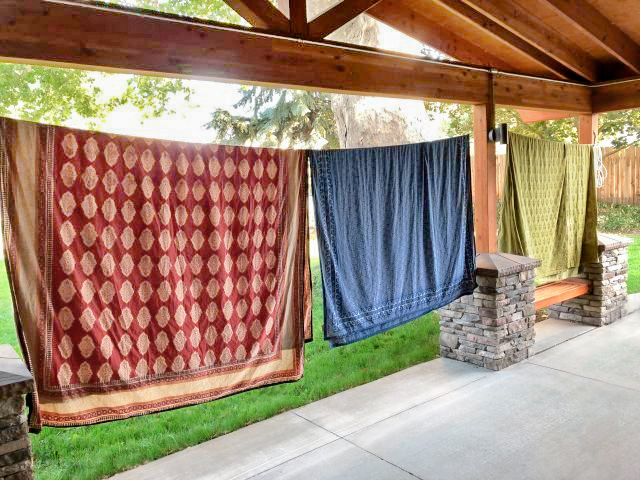 freshly dried linens, block print, hanging on a line