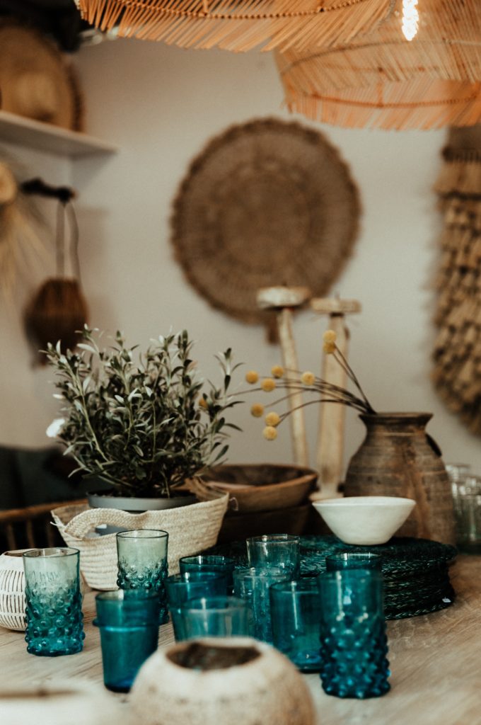 French cottage kitchen with blue glass and baskets
