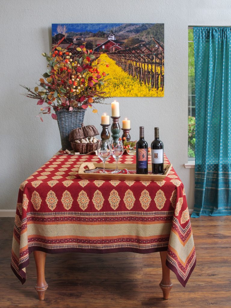 red Thanksgiving tablecloth at a bohemian table setting