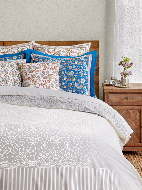 white duvet cover with colorful pillows