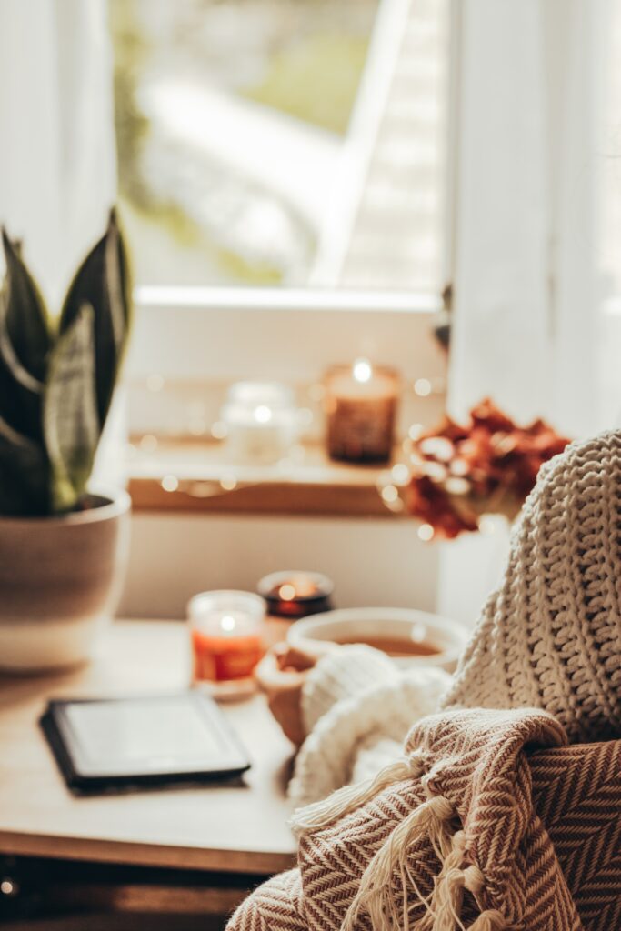 hygge style with blanket, soup, and candles