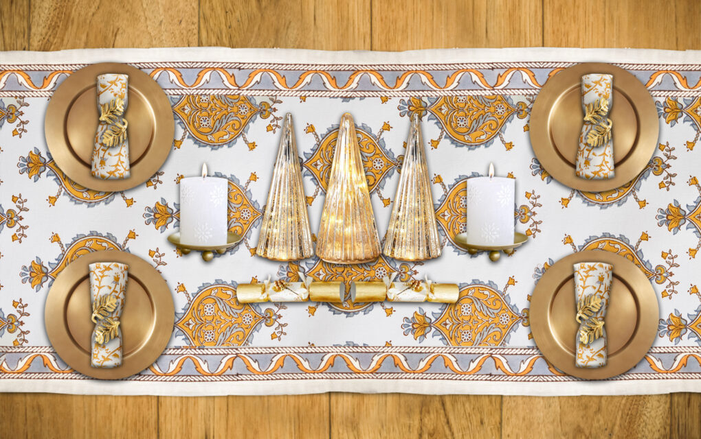 Elegant Christmas table runner idea using white, gold, and silver color palette