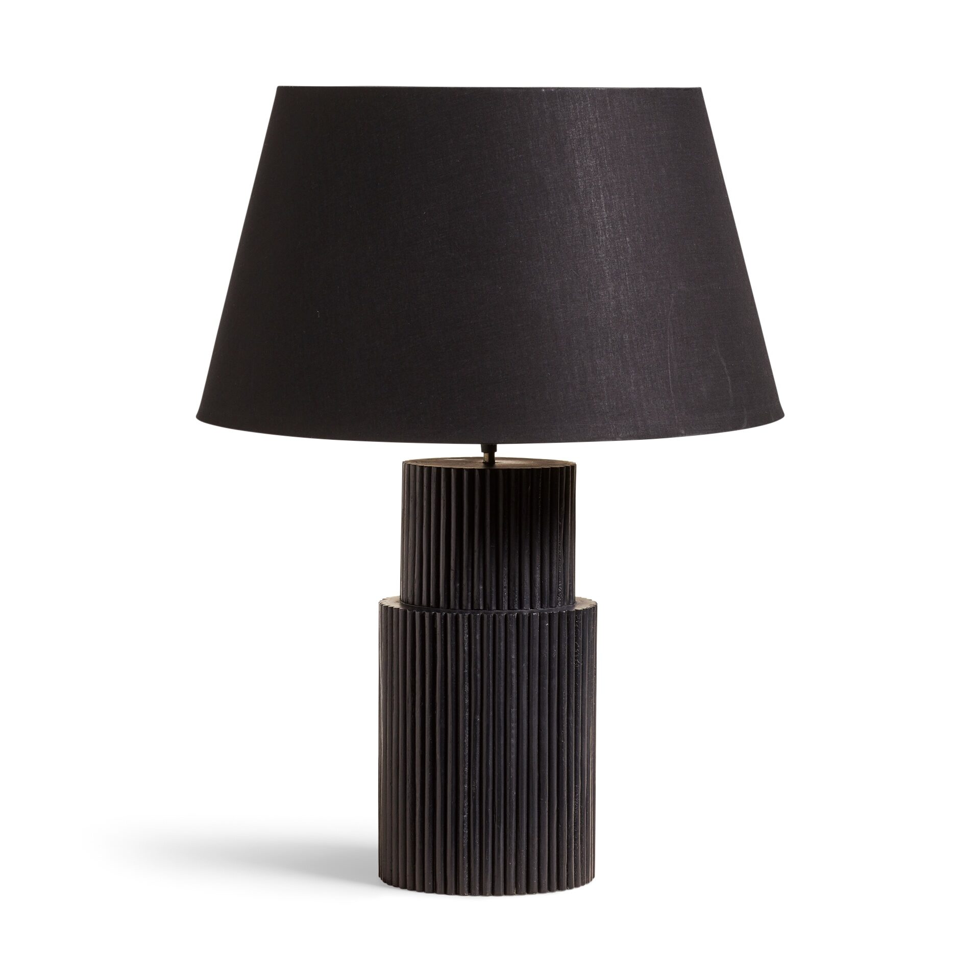 A black table lamp with a grooved base