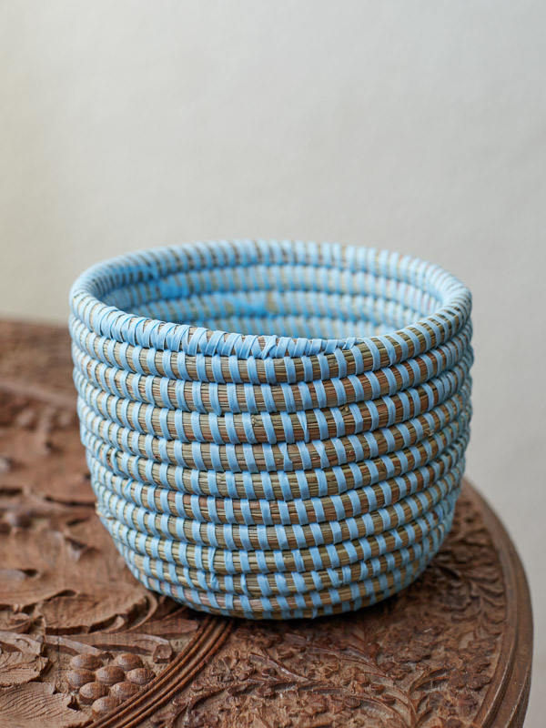 An empty light blue mini woven plant basket for succulents