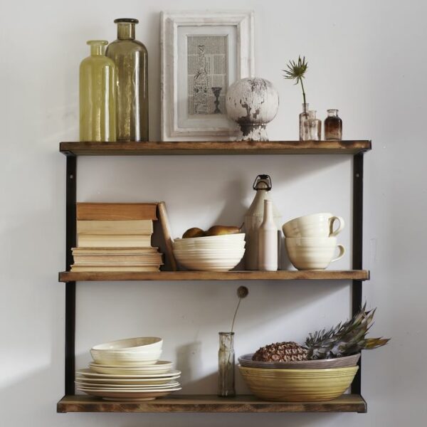 Functional kitchen shelf decor on a fixed bracket shelf