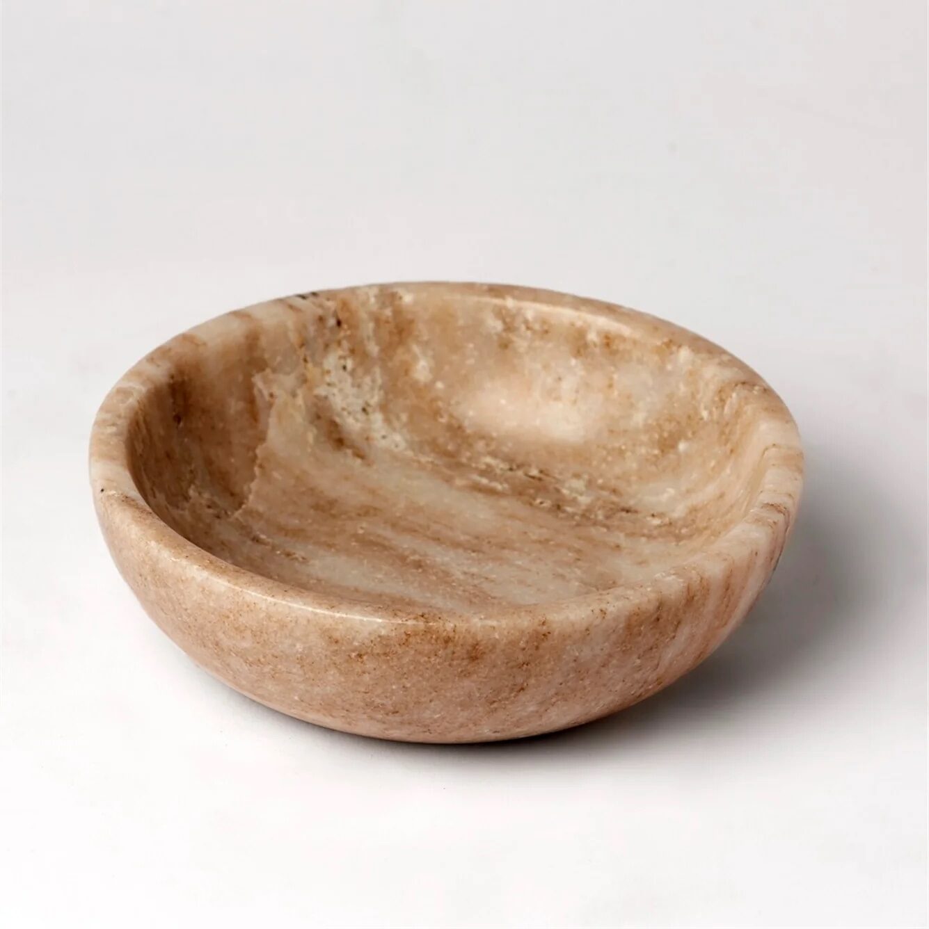 An empty, decorative marble bowl