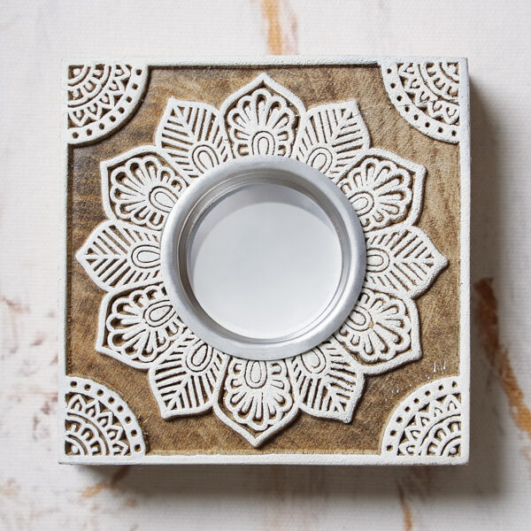 A brown and white wooden tea light holder to exhibit a kind of white decor
