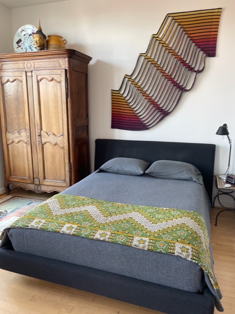 Image of a bedroom showing aesthetic benefits when you follow steps on how to declutter your home