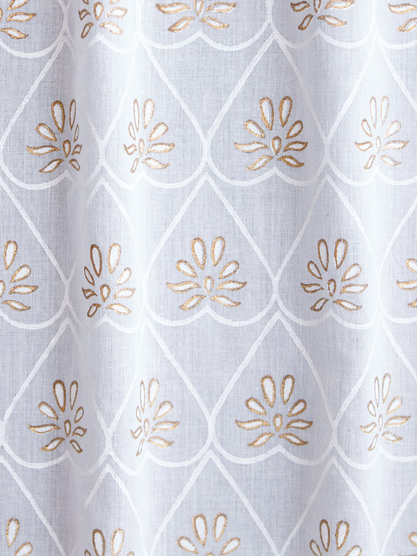 A white and gold fabric swatch that can be used with white decor