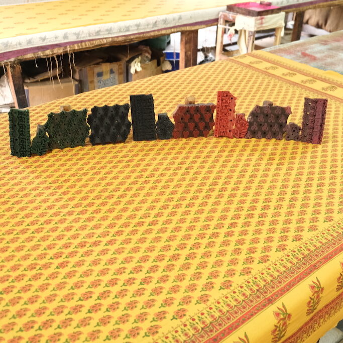 Photograph of paisley print and the wooden blocks used to create it