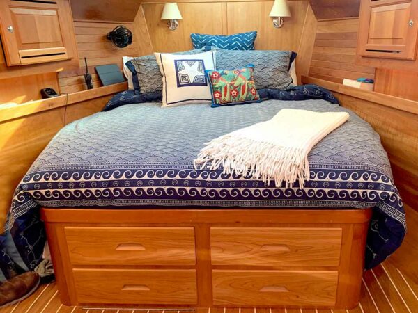 Modern bohemian style bedroom with a touch of coastal style using block print bedding and wooden furniture