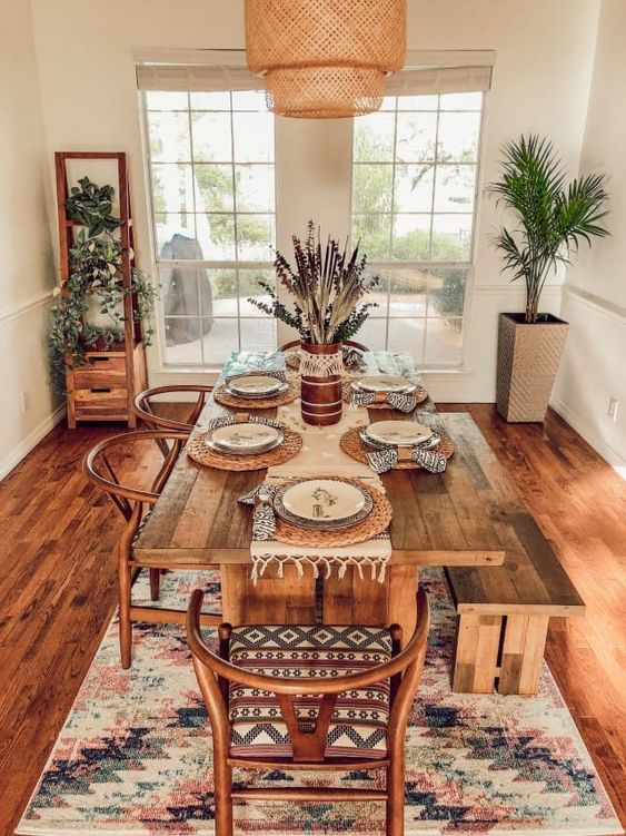 Modern bohemian style dining room using wooden furniture and nature-inspired decor