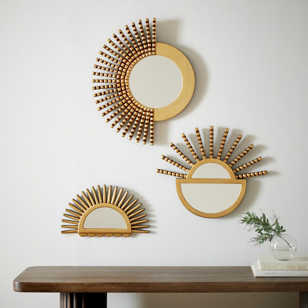 Gold-rimmed wall mirrors for boho style home decor in the living room