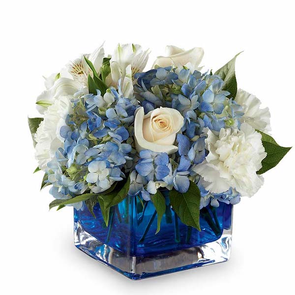Chanukah Christmas table setting with blue and white flowers