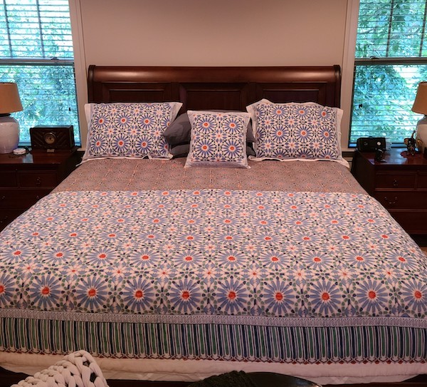 Photograph of modern boho bedding to demonstrate how to beat the winter blues with lively bedspreads