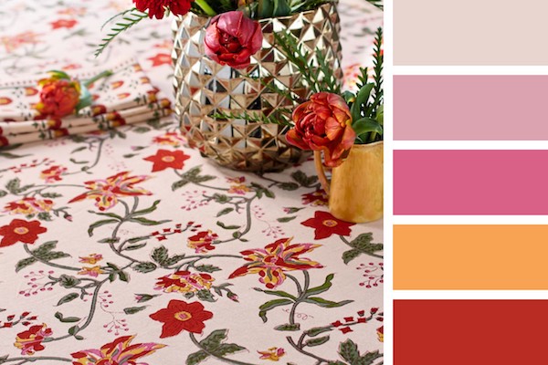 Photograph of a tropical and floral table setting to demonstrate when is wedding season for the summer months and how to decorate for it