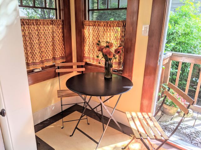 orange cafe curtains in dining nook