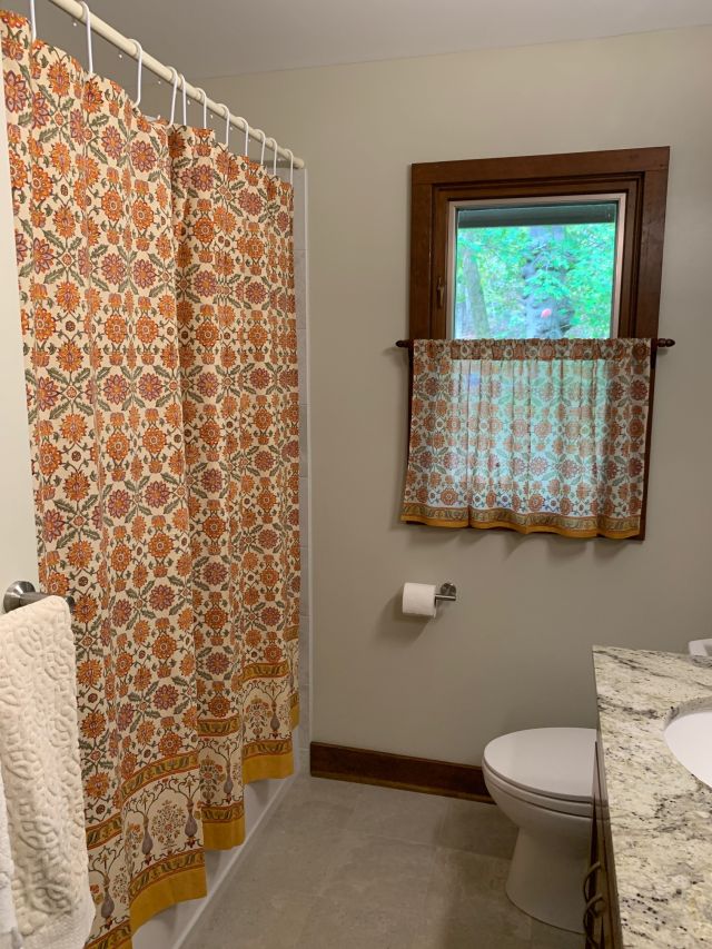 orange floral bathroom window curtain and shower curtain
