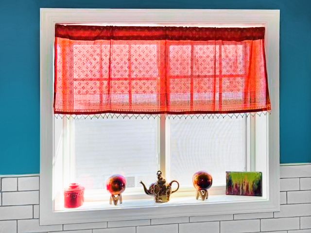 Indian curtain with beads and Indian decor at the window